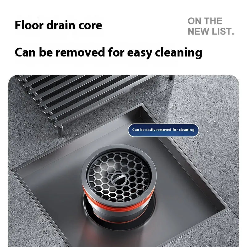 Gun grey 15cm square ABS plastic core sitting in a 304 stainless steel courtyard floor drain frame.