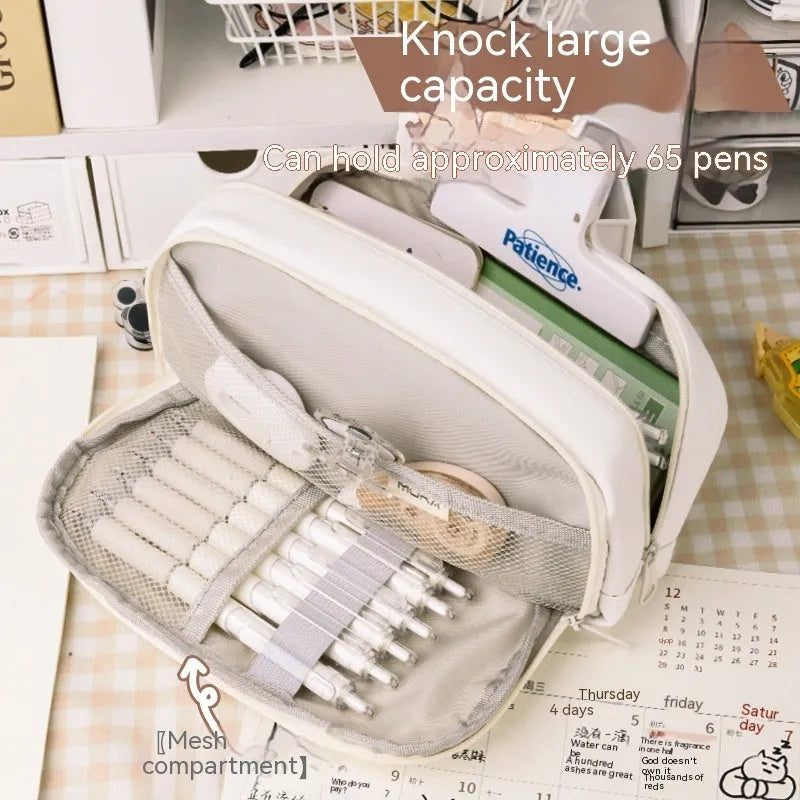 Korean-style canvas pencil case in green, beige, blue, and grey colours storing approximately 80 pens