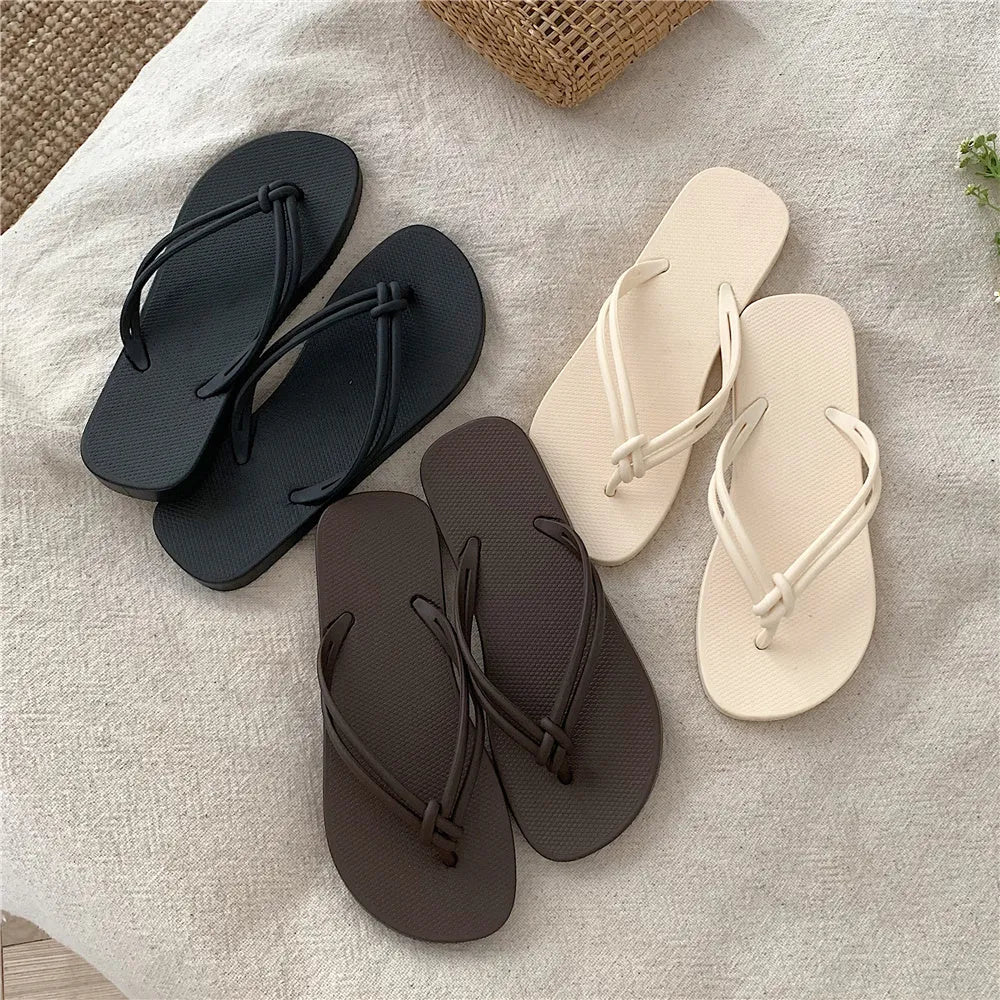 Men's PVC flip flop slippers in beige with a toe-covering design and injection moulded sole.