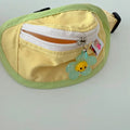Powder blue, yellow, green, and pink backpack-style carrier for small dogs and cats on a white background.