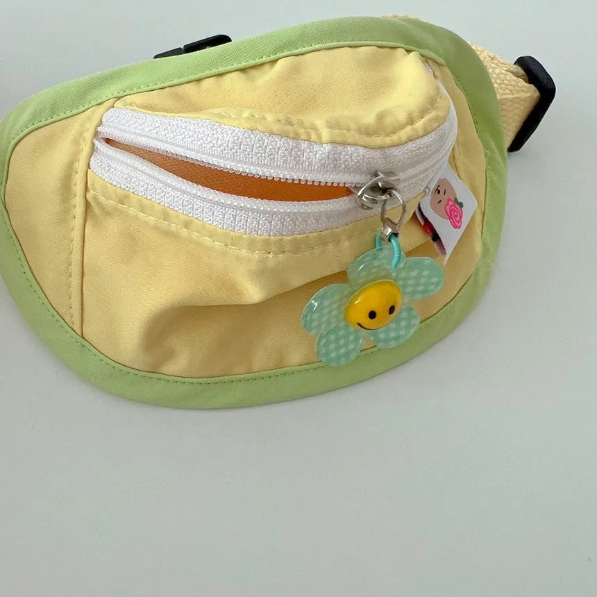 Powder blue, yellow, green, and pink backpack-style carrier for small dogs and cats on a white background.