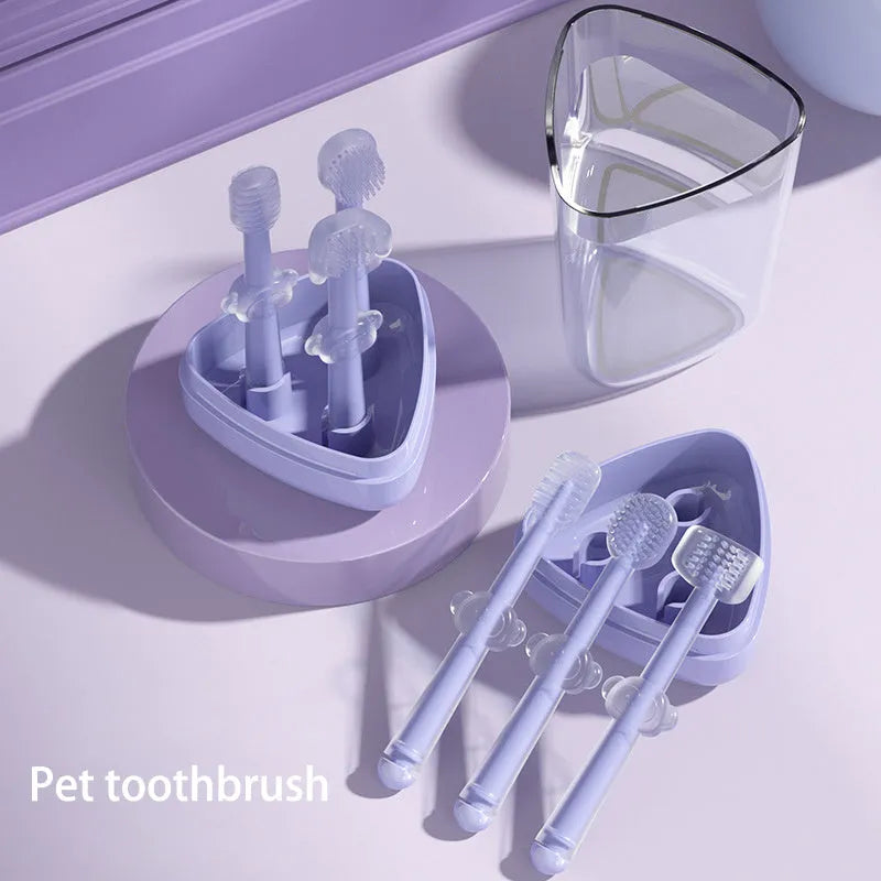 Blue silicone pet toothbrush with soft bristles and ergonomic handle for dog and cat dental care.