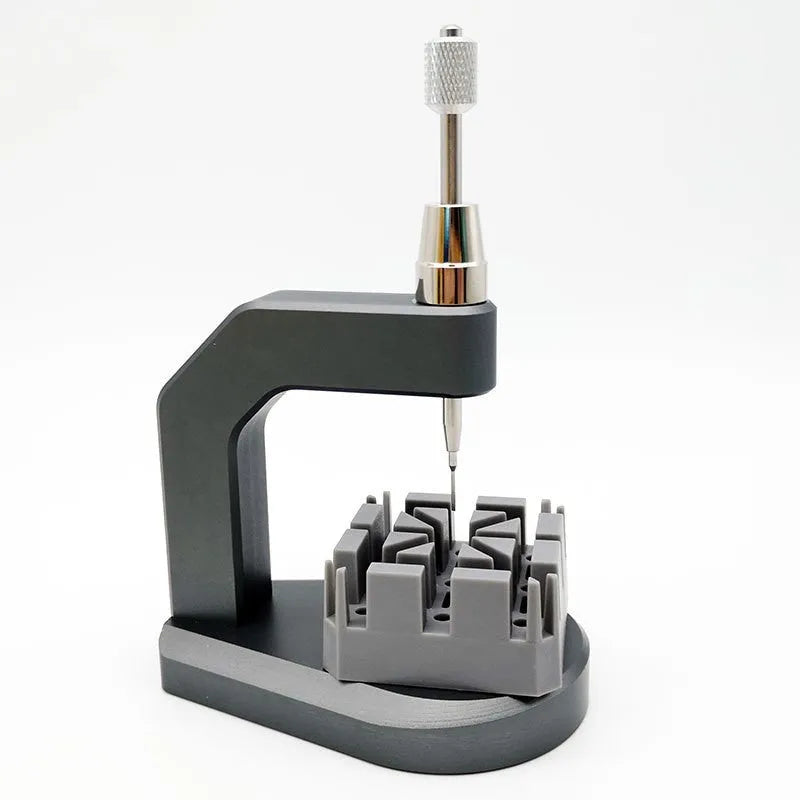 Silver tool steel multi-purpose press strap removal tool with 0.50-1.60mm blade on a workshop surface.