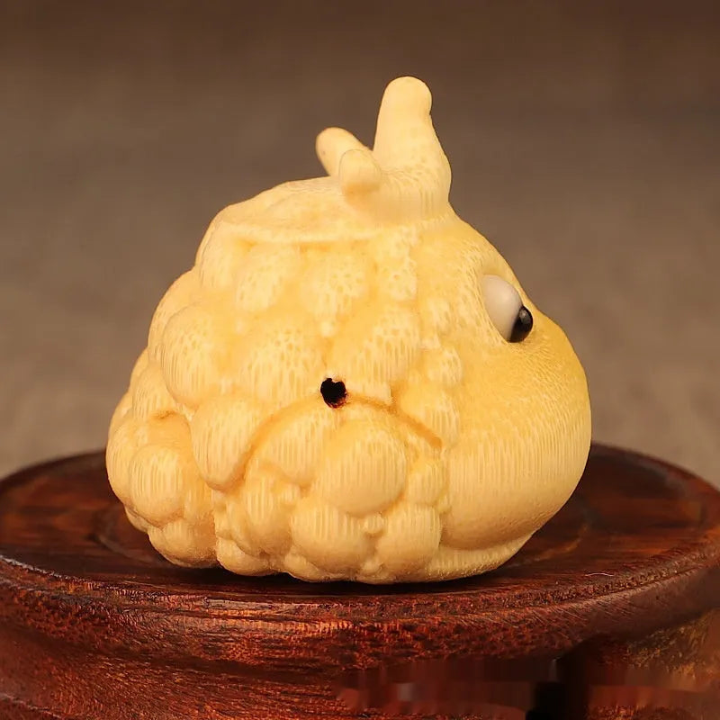 Solid bamboo carving of a cute Crown Princess toad hand ornament