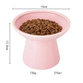 White ceramic elevated cat bowl with wide shallow dish on wooden floor