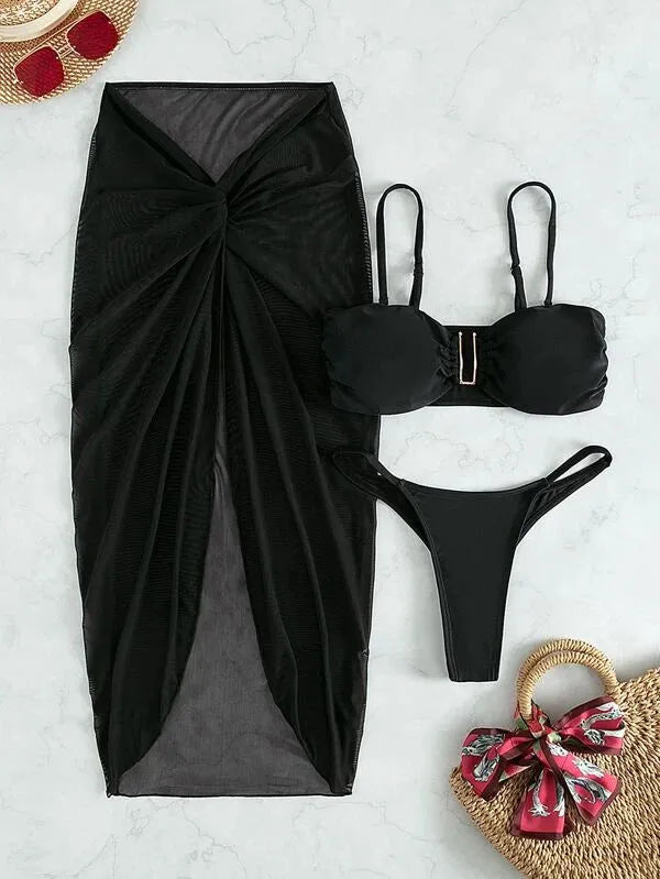 Women's multicolour three-piece bikini set with long culottes on a hanger, showing skirt, bra, and briefs.