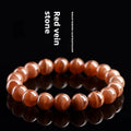 Natural Old Mine Rhodochrosite round beads bracelet from Peru showing manganese spar mineral colour