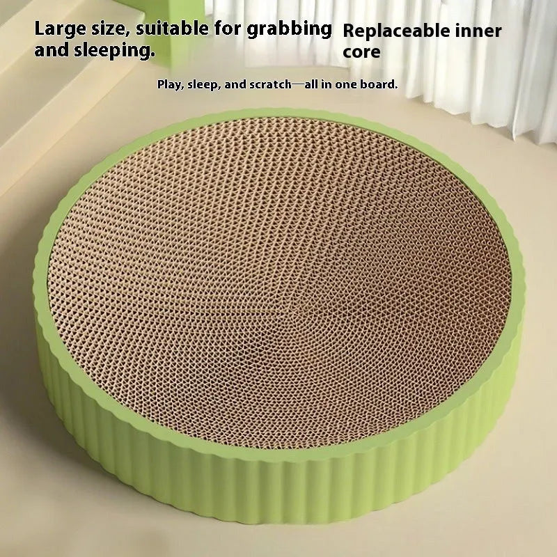 Round green cat scratching board with corrugated paper insert measuring 55cm diameter with two replacement refills