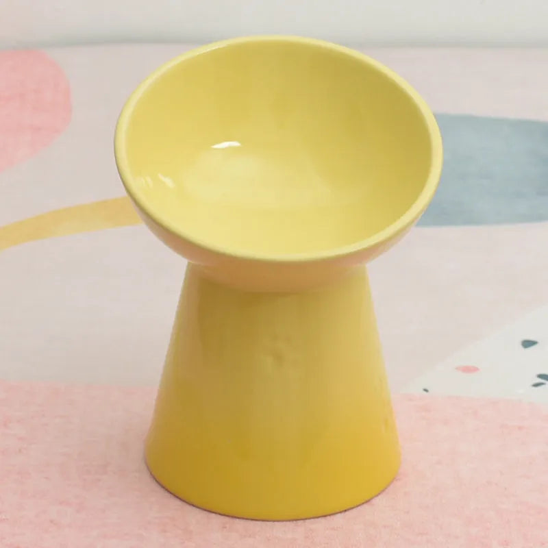 Ceramic pet bowl with high foot design showing anti-tumble stability feature