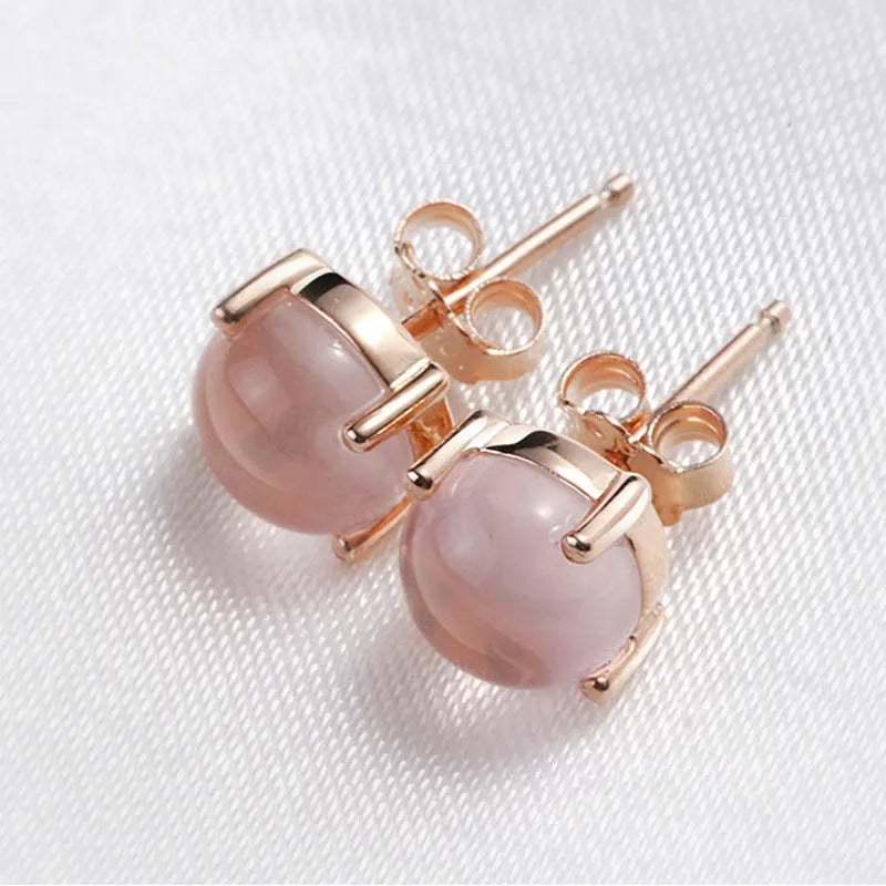Women's rose gold plated silver earrings with synthetic quartz drop shape design