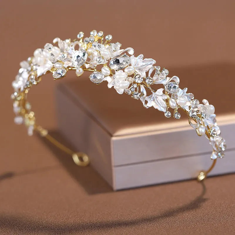Women's pearl-decorated alloy crown headdress in gold or silver electroplated finish.