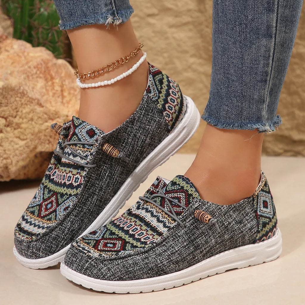 Women's low-top slip-on flat shoes with a round toe in artificial PU, shown in khaki colour on a white background.