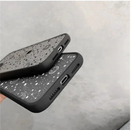 Black and white iPhone cases with textured surface and blue light reduction feature for multiple models.