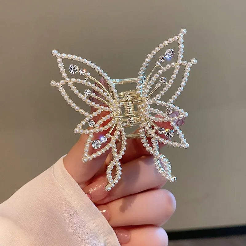 Butterfly-shaped hair barrettes for women with alloy construction and decorative rhinestone or pearl styling