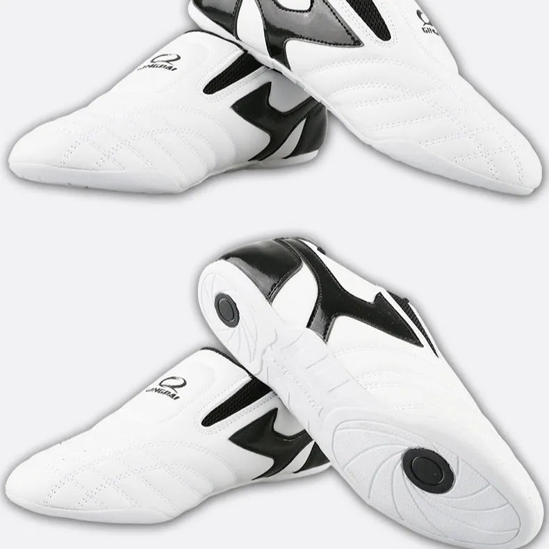 Black and white children's martial arts shoes with soft sole and widened fit for boxing training