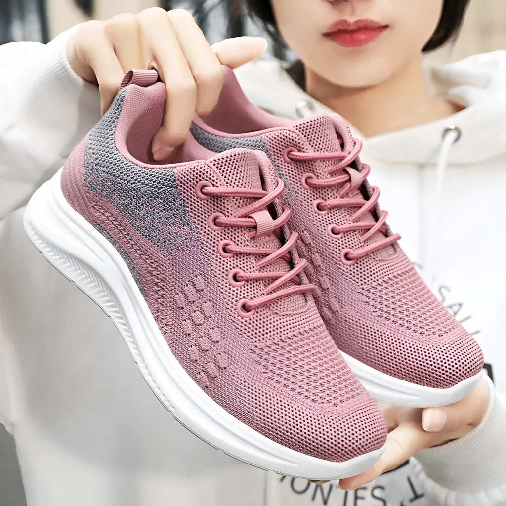 Women's black mesh sneakers with round toe and lace-up front on soft PVC sole