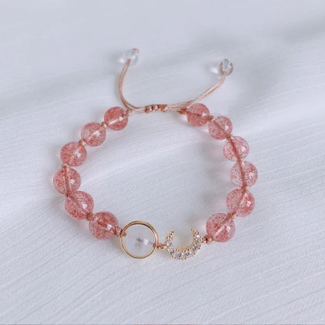 Handmade strawberry quartz crystal bracelet for women showing natural bead designs