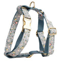 Blue floral patterned fabric bow attached to a decorative dog collar for pets