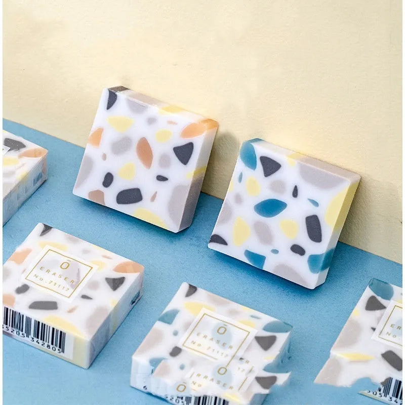White rubber brick-format eraser for students on a plain background