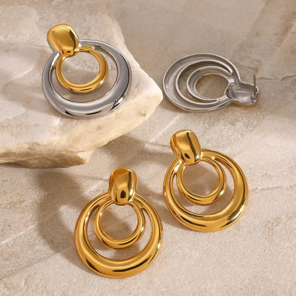 Golden round geometric double-layer hollow stud earrings with 18K gold electroplating on titanium steel