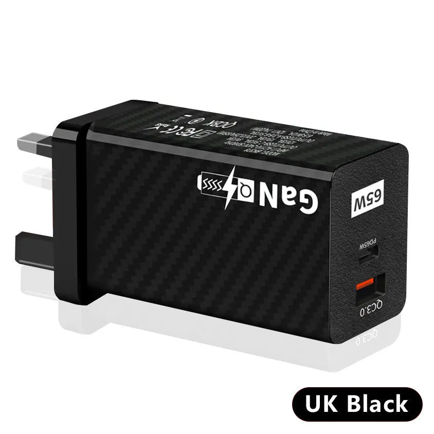 65W GaN fast charger showing compact size next to laptop with USB-C cable