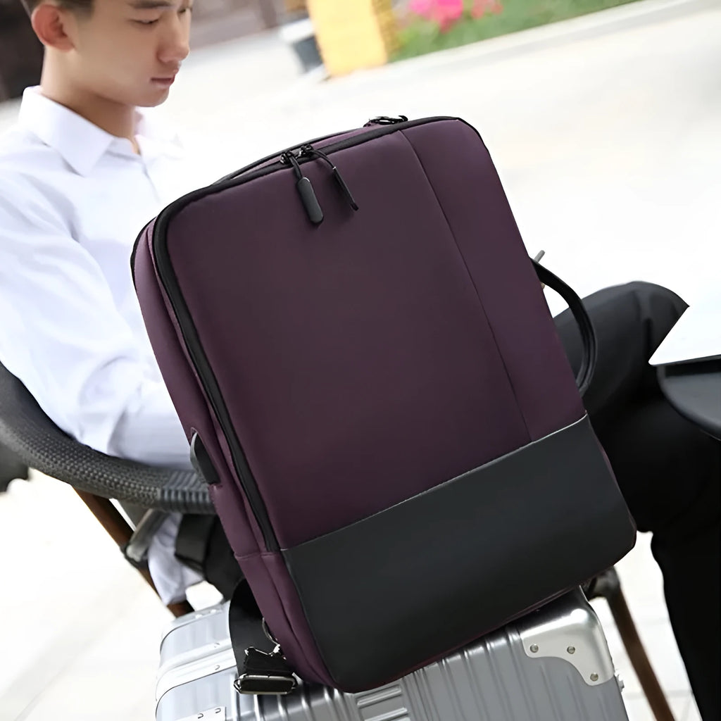 Medium waterproof nylon backpack in brown with zipper closure and soft surface finish for men and women
