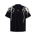 Black women's T-shirt with rivet ribbon padded shoulders and loose fit short sleeve design
