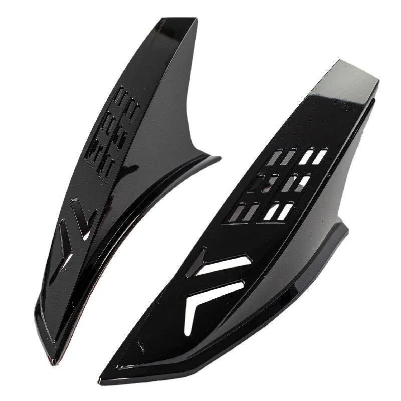 A pair of black decorative horns for a children's helmet with 3M adhesive backing.