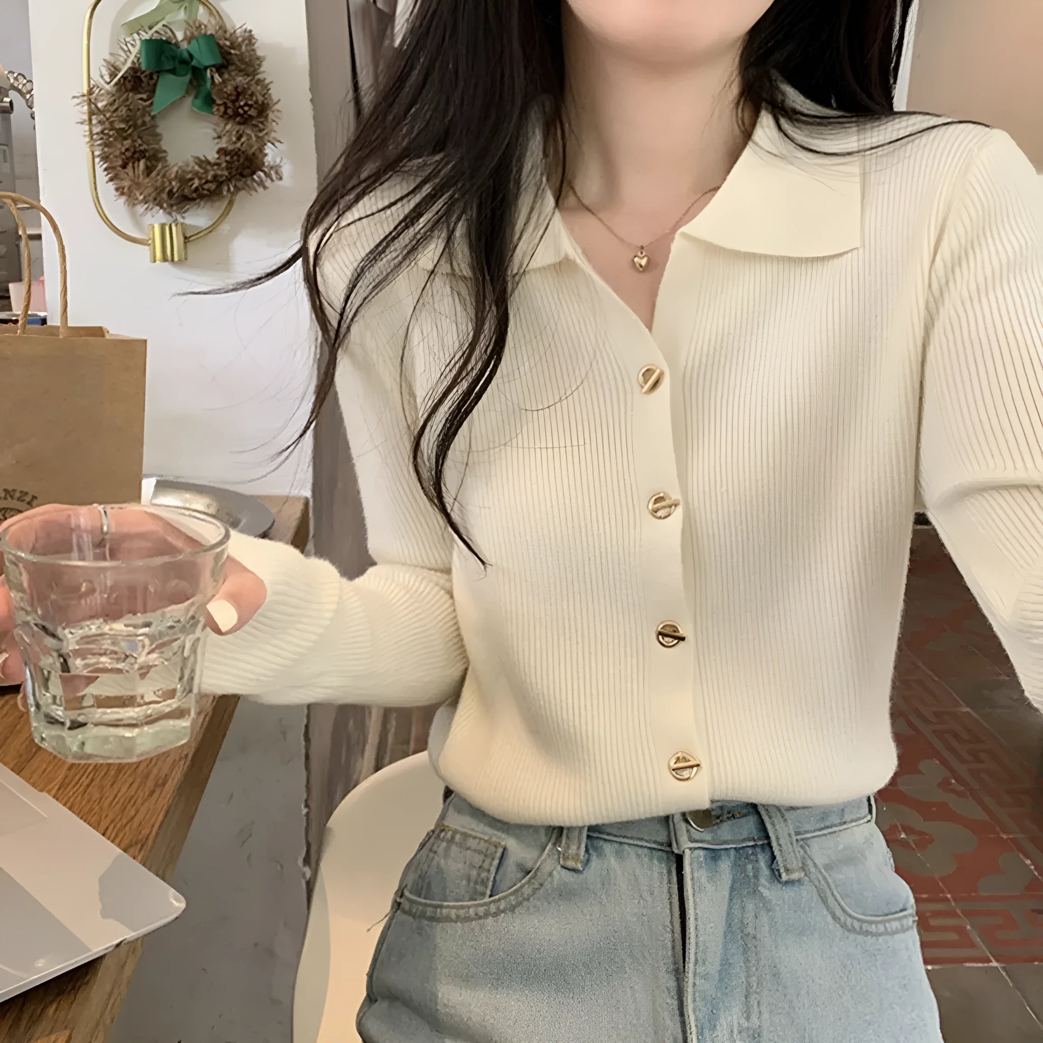 Loose-fitting knitted cardigan in viscose fibre showing long sleeves and neutral colour options