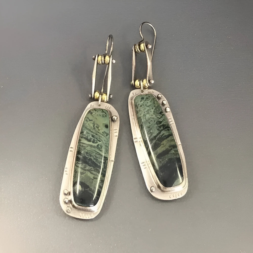Geometric two-colour marble pattern alloy earrings with simple contemporary design