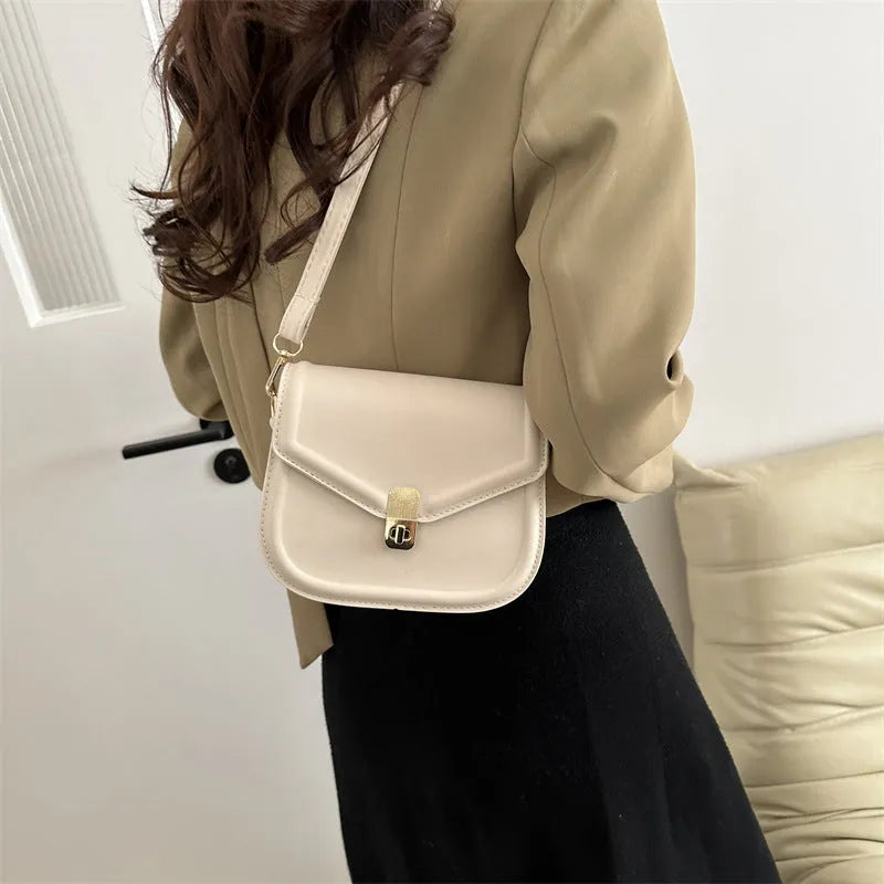 Soft horizontal square messenger bag in clamshell design, shown in black colour.