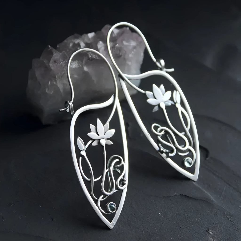 Silver rhinestone earrings with lotus vine design featuring geometric floral shapes and round crystal elements