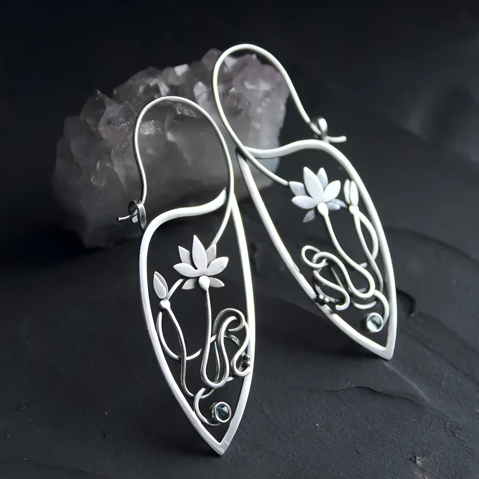 Silver rhinestone earrings with lotus vine design featuring geometric floral shapes and round crystal elements