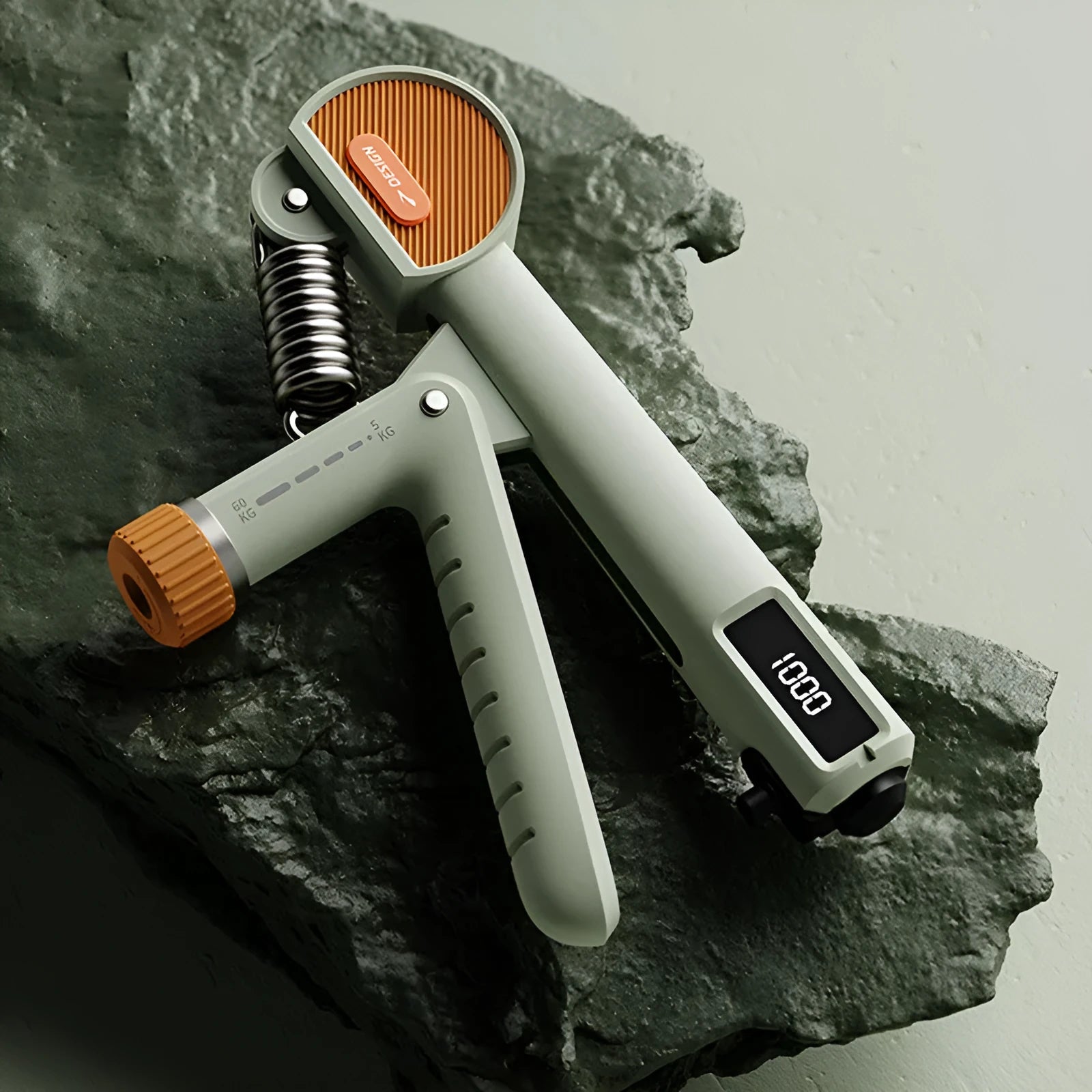 Adjustable hand grip exerciser in ABS plastic shown in various colours including ivory white and dark black.