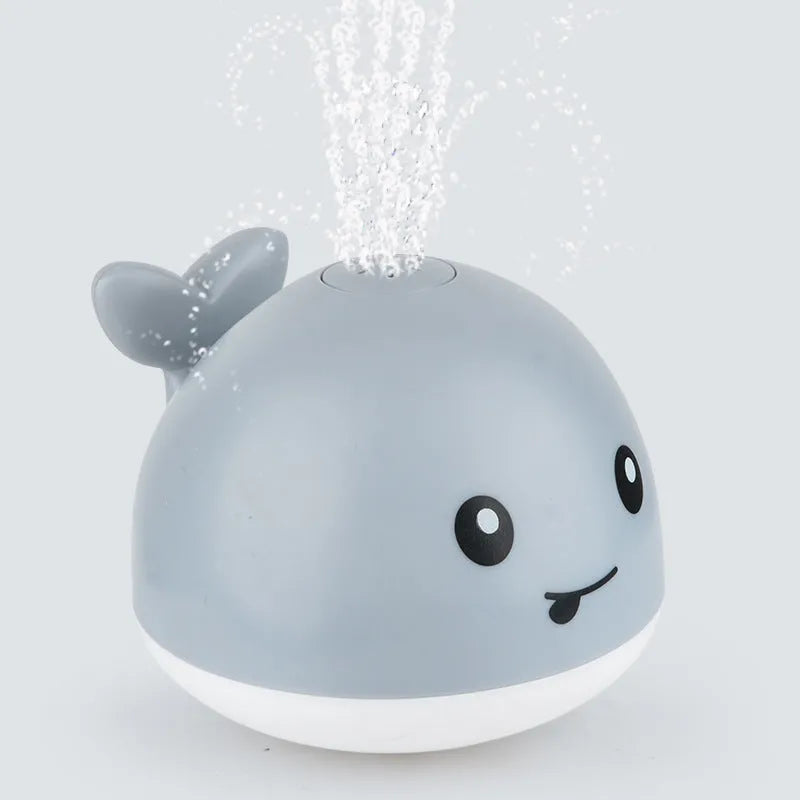 Automatic water spray whale bath toy with lights floating in baby bath
