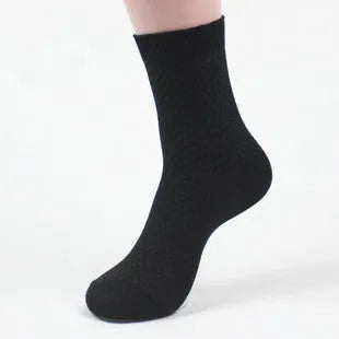 Men's bamboo fibre business socks in small square pattern, shown in classic colours on a grey background.