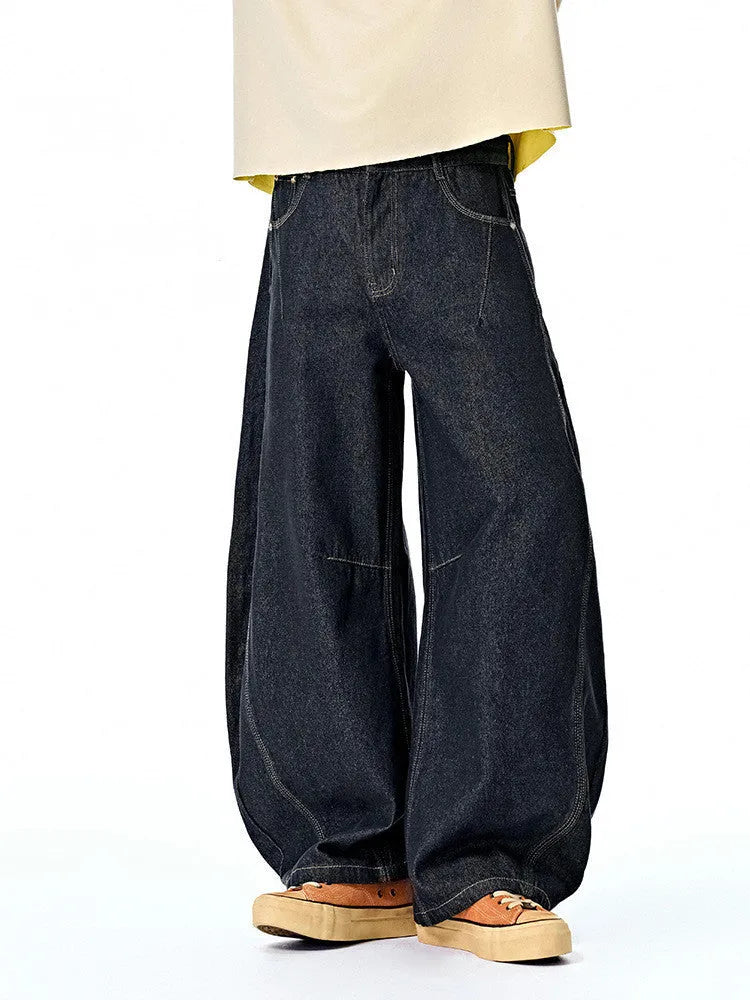 Men's wide leg denim trousers in original cow colour showing relaxed fit and mid waist construction