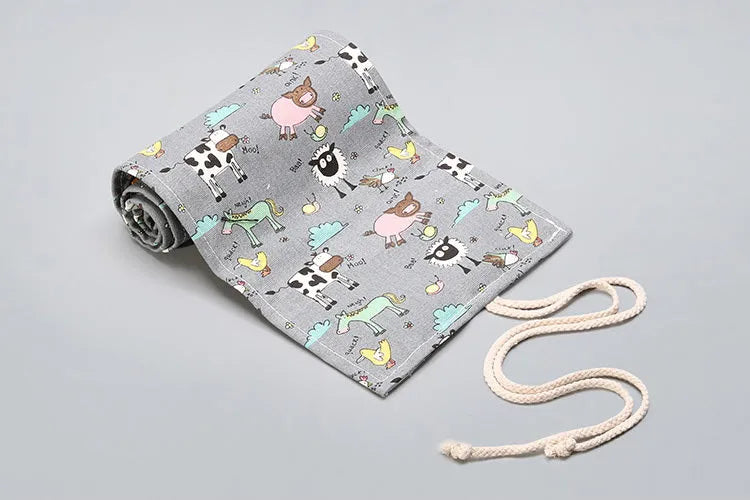 Canvas pencil wrap with multiple elastic bands rolled up showing slot configuration