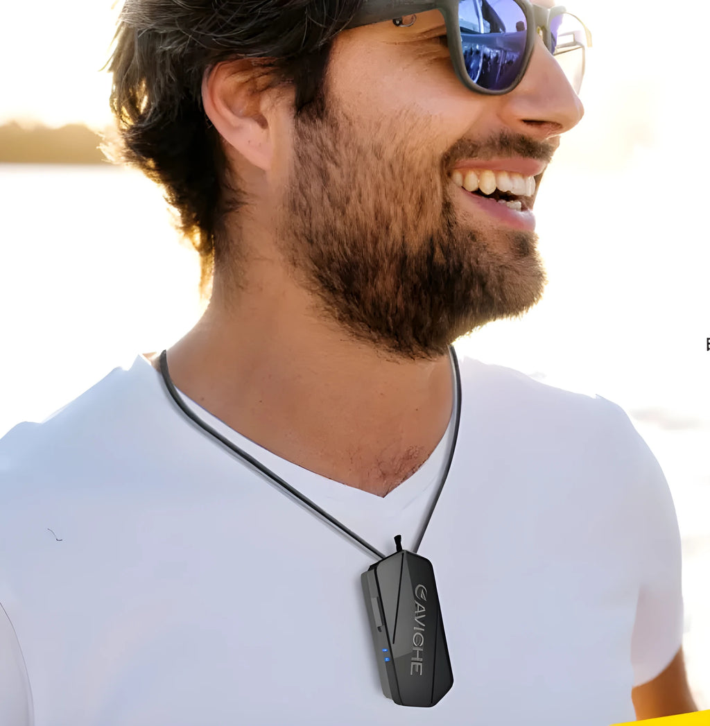 Black personal air purifier necklace worn around neck, showing compact rectangular shape.