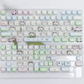 PBT sublimation key cap set showing colourful puppy and cat artwork on mechanical keyboard keys