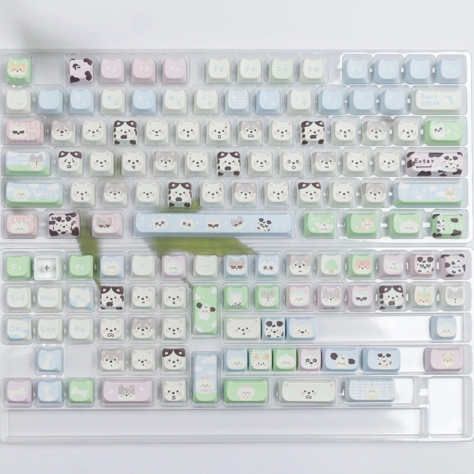 PBT sublimation key cap set showing colourful puppy and cat artwork on mechanical keyboard keys