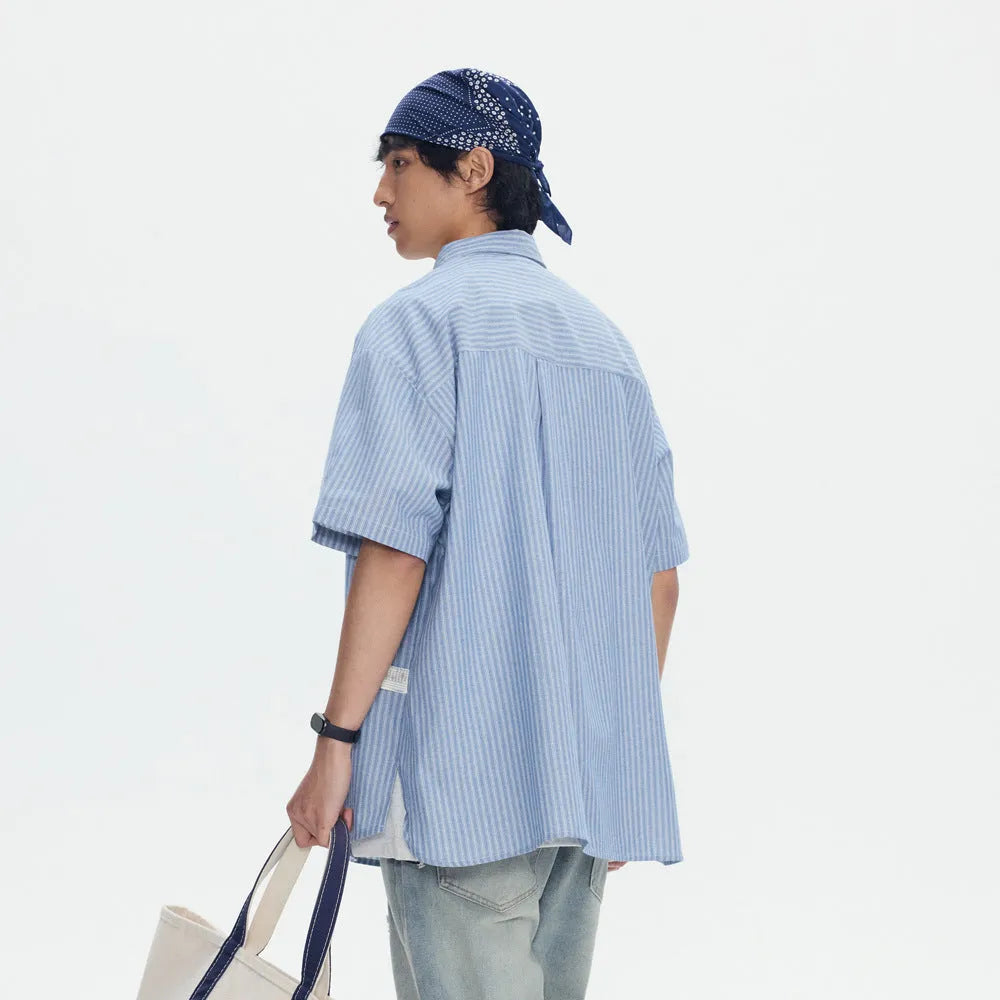 Blue striped loose fit overalls shirt with short sleeves on hanger