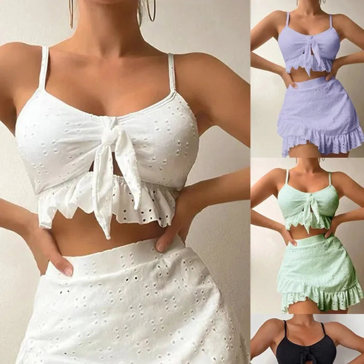 Women's solid colour three-piece swimsuit with bikini top, bottoms, and split hip skirt.