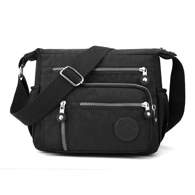 Grey nylon shoulder messenger bag with single strap and square vertical design