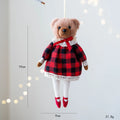 Cartoon plush bear doll wearing a cotton suit with a plaid print, in two colour options.