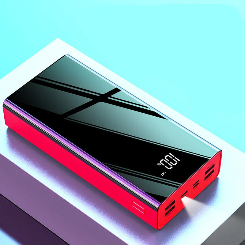 Large black or red 40000mAh power bank with LCD display screen showing battery percentage.