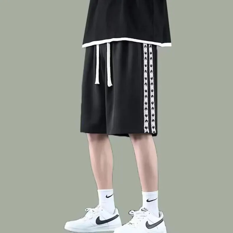 Men's loose-fit track pants in polyester fibre available in three colours and seven sizes