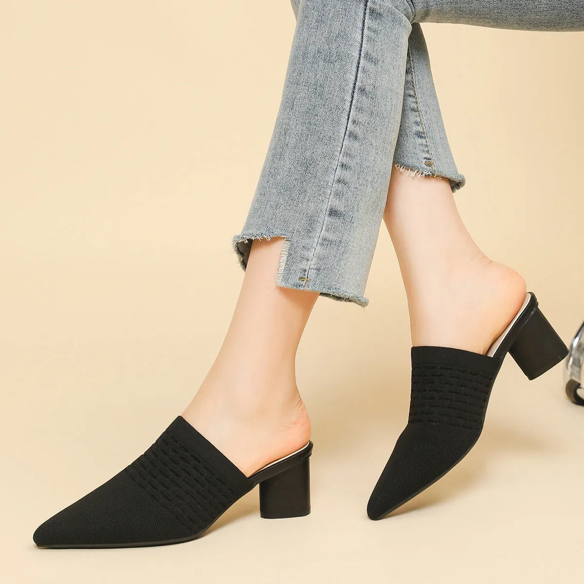 Women's black pointed toe sandals with a fabric upper and 5cm chunky rubber heel.