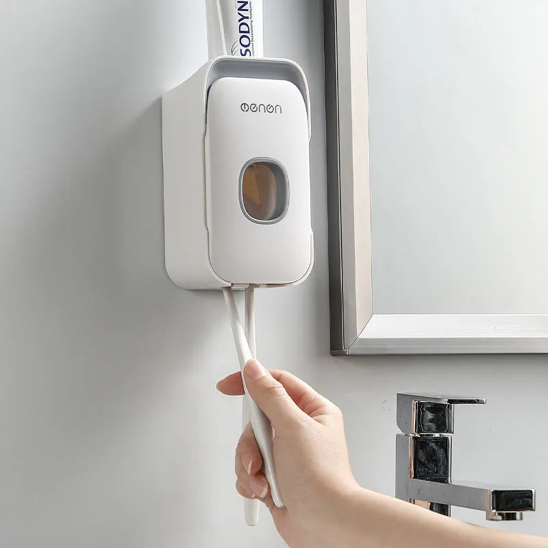 Automatic toothpaste dispenser in blue, grey or pink colours with sensor activation