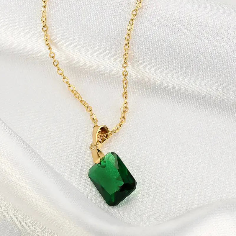 Rectangular geometric copper necklace with quadrilateral design on green background